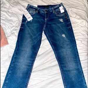 Skinny leg mid rise blue jeans.
